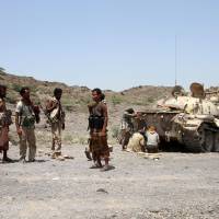 Yemeni pro-government forces fire toward Houthi rebels positioned in the hills of the Sharija region on the borders of Taiz and Lahj provinces on Sunday. Forces kill suspected al-Qaida leader in Yemen home