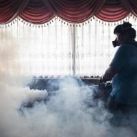 A city worker sprays chemicals with a fumigator to kill mosquitoes in an effort to control the spread of the Zika virus at a school in Bangkok on Sept. 14. Thai health authorities on Friday said microcephaly in two babies was caused by the Zika virus, in what is believed to be Southeast Asia’s first confirmed cases linking the sickness and the birth defect. First Thai babies diagnosed with Zika-linked microcephaly