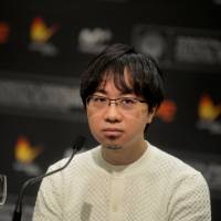 Director Makoto Shinkai takes part in a news conference to promote the animated film Your Name. at the San Sebastian Film Festival in northern Spain on Sept. 24. Animated film 'Your Name.' taking nation by storm