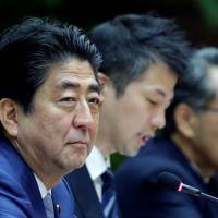 Prime Minister Shinzo Abe attends a meeting in Havana on Thursday. Abe could become Japan's longest-serving leader despite mixed record