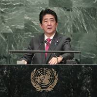 Prime Minister Shinzo Abe addresses the 71st United Nations General Assembly on Wednesday. Abe urges world to find 'new means' to stop North Korea