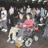 Members of People First offer a silent prayer for victims of the Tsukui Yamayuri En care home massacre in Yokohama on Wednesday. Disabilities group cries foul over name secrecy in Sagamihara care home massacre