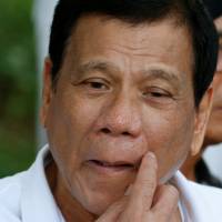 Philippine President Rodrigo Duterte arrives in San Miguel, Bulacan, in the northern Philippines on Sept. 15. Duterte plans to make first China, Japan visits in October