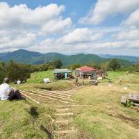 People rest atop Mount Jinba on the border of Tokyo and Kanagawa Prefecture on Saturday. Summer saw record 660 mountaineering accidents across Japan
