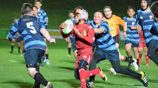 Japanese junior rugby player Rikitora Tani of Fujita Juku plays in a match against a New Zealand team Sept. 9 in Taupo, New Zealand. Rugby fever draws Japan youth to New Zealand