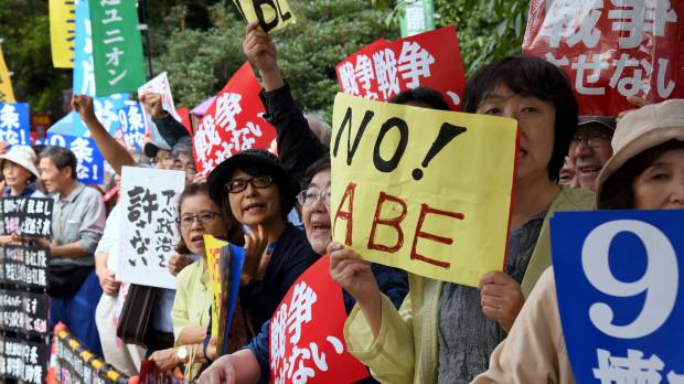 People shout slogans during an anti-government rally in front of the Diet during a protest last September against Prime Minister Shinzo Abe's controversial security bills aimed at expanding the remit of the country's armed forces. Lawsuit challenging controversial security laws filed by group at Hiroshima Prefecture court