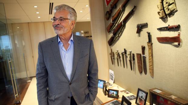 Businessman Dick Portillo is seen with military memorabilia in his Oak Brook Terrace, Illinois, office on Sept. 8. Portillo is on a quest to determine whether a gold tooth discovered is that of Adm. Isoroku Yamamoto, a mythic figure in Japanese history who planned the Pearl Harbor attack. Chicago hot dog czar may have Japanese World War II admirals's gold tooth