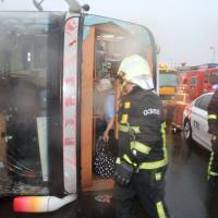 A tour bus is seen overturned on the Formosa Freeway in Changhua, Taiwan, Tuesday. Typhoon Megi roars through Taiwan, leaves four dead, over 300 injured, including eight Japanese tourists