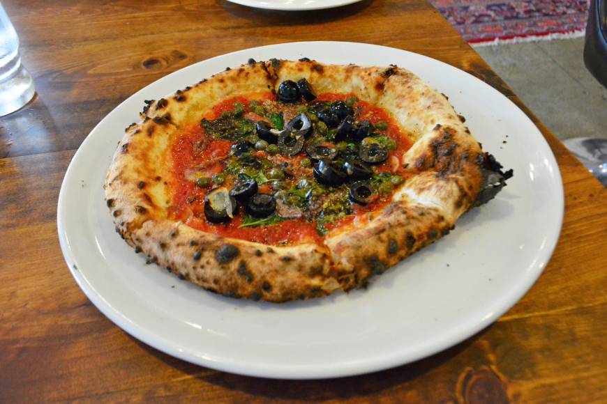 Galleria Thin and crispy: Galleria's Siciliana is cooked Neapolitan-style. | J.J. O'DONOGHUE