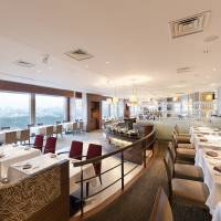 Fine French fare high above the city; N.Y. chef brings talents to Tokyo; reopening sees accommodation plan