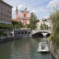 Water world: People walk across a bridge in Ljubljana. Melania Trump puts Slovenia on the map