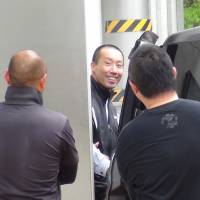 Far side of society: A ex-yakuza pimp leaves the Nagano Prefecture courthouse in Matsumoto. The defendant, who had started his own call girl service, changed from defiance to remorse throughout the hearings. Say you're sorry: In court with Japan's rascals, killers and dope heads