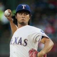 Texas' Yu Darvish pitches during the Rangers' 11-2 defeat to the A's on Saturday. Darvish struggles as Rangers lose to A's