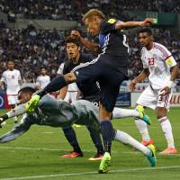 Japan forward Keisuke Honda shoots against United Arab Emirates goalkeeper Khalid Eisa during the UAE's 2-1 win in a World Cup qualifer in Saitama on Thursday. Honda slams referee after 'ghost goal' haunts Japan's loss to UAE