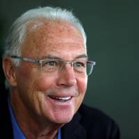 Franz Beckenbauer, seen in a file photo from June 2013, is being investigated by Swiss authorities on corruption allegations linked to the awarding of the 2006 World Cup to Germany. Beckenbauer cancels Swiss trip amidst investigation
