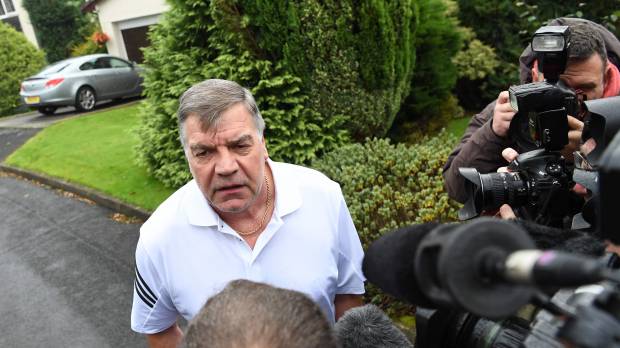 Former England manager Sam Allardyce speaks to the media outside him home in Bolton, England, on Wednesday. Regretful Allardyce says entrapment led to England exit