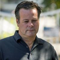 Former NASCAR racer Robby Gordon pauses while making a statement to members of the media gathered outside his home in Orange, California, on Thursday. Gordon said his family is in shock and grieving the loss of his father and stepmother, who were found dead inside their Southern California home. Ex-NASCAR racer Robby Gordon's dad, stepmom found dead in California home