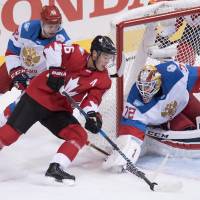 Canada's Jonathan Towes looks for a way past Russian goalie Sergei Bobrovsky during their semifinal game on Saturday. Canada beats Russia to reach final round