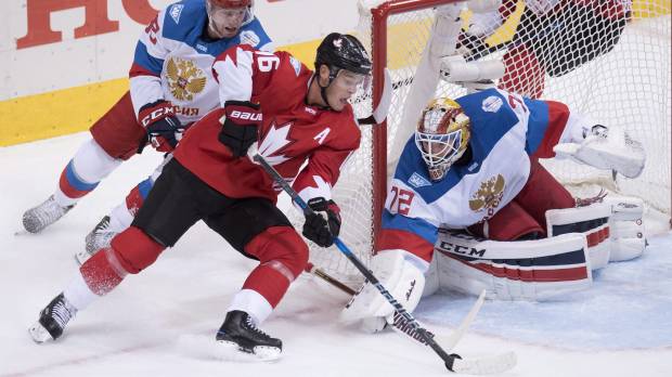 Canada's Jonathan Towes looks for a way past Russian goalie Sergei Bobrovsky during their semifinal game on Saturday. Canada beats Russia to reach final round