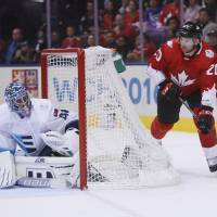 Canada’s John Tavares skates behind Team Europe goalie Jaroslav Halak during Game 1 of the World Cup of Hockey finals in Toronto on Tuesday. Canada won 3-1. Canada lands first blow in World Cup finals