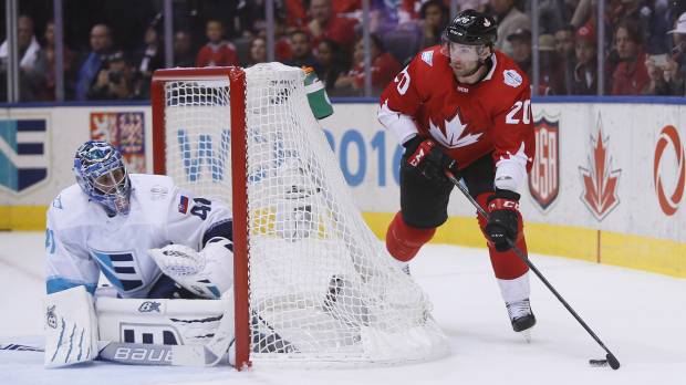 Canada’s John Tavares skates behind Team Europe goalie Jaroslav Halak during Game 1 of the World Cup of Hockey finals in Toronto on Tuesday. Canada won 3-1. Canada lands first blow in World Cup finals