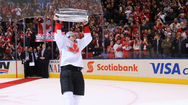Team Canada's Sidney Crosby holds up the World Cup of Hockey championship trophy after Thursday's 2-1 victory over Team Europe. Canada edges Team Europe to capture World Cup