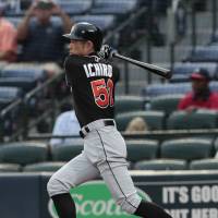 Miami's Ichiro Suzuki strokes a double against Atlanta in the first inning on Monday night. The Braves beat the Marlins 12-7. Ichiro raps out 3 hits, raises average to .301