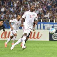 The United Arab Emirates' Ahmed Khalil (11), seen scoring on a penalty kick, had two goals against Japan in Thursday night's World Cup qualifier at Saitama Stadium. UAE recorded a 2-1 victory over Japan. UAE capitalizes on Japan's miscues to secure victory