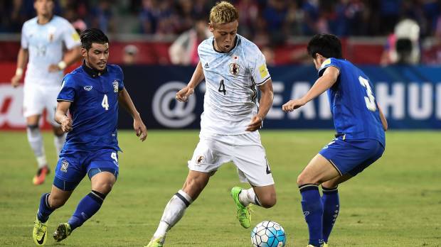 Keisuke Honda takes on the Thailand defense during Japan's 2-0 win at Bangkok's Rajamangala Stadium on Tuesday night in a World Cup qualifier. Japan earns crucial breathing space with win over Thailand