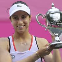 Christina McHale of the United Sates holds the Japan Women's Open winner's trophy after beating Katerina Siniakova of the Czech Republic in Sunday's final at Ariake Tennis Forest Park. McHale edges Siniakova for Japan Women's Open title