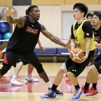 Ira Brown (left) has joined the Japanese team after recently acquiring citizenship. Japanese men search for ways to improve
