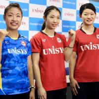 Rio Olympic bronze medalist Nozomi Okuhara (left) and gold medalists Misaki Matsutomo (center) and Ayaka Takahashi pose during a news conference on Thursday. Badminton riding wave of popularity after Japan squad's success in Rio