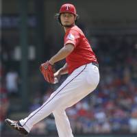 Rangers starter Yu Darvish pitches against the Astros on Sunday in Arlington, Texas. Darvish fell to 5-4 this season. Darvish struggles as Rangers fall against Astros