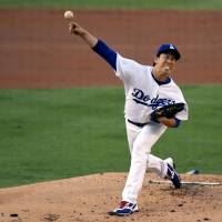 Los Angeles starter Kenta Maeda pitches against Arizona in the first inning on Monday night. The Dodgers won 10-2. Maeda collects 14th win in rout of D-Backs