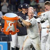 The Yankees' Tyler Austin (right) is doused with water by teammate Brett Gardner after his walk-off home run gave the Yankees a 5-4 win over the Rays on Thursday at Yankee Stadium. Rookie Austin lifts Yanks with walk-off shot