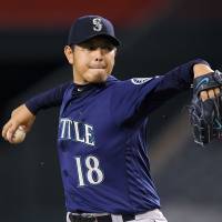 Mariners starter Hisashi Iwakuma fires a pitch in Wednesday's game against the Angels in Anaheim, California. Seattle defeated Los Angeles 2-1, extending its season-best winning streak to eight games. Mariners' Iwakuma notches 16th victory of season