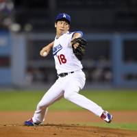 Los Angeles starter Kenta Maeda pitches against San Francisco in the first inning on Wednesday night. The Dodgers won 9-3. Maeda, Puig power Dodgers