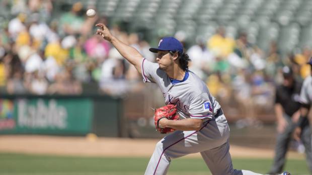 The Rangers’ Yu Darvish pitches against the A’s on Saturday in Oakland. The AL West champions beat the A’s 5-0. Darvish, Andrus lead Rangers to victory