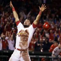 St. Louis' Matt Carpenter celebrates after scoring the winning run against Cincinnati in the ninth inning on Thursday night. Blown call costly for Reds