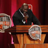 Shaquille O'Neal smiles during his induction speech at the Naismith Memorial Basketball Hall of Fame on Friday in Springfield, Massachusetts. Shaq, Iverson headline Basketball Hall of Fame class