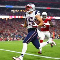 Patriots receiver Chris Hogan scores during New England's 23-21 victory over the Cardinals on Sunday in Glendale, Arizona. Patriots edge Cardinals in first game without star QB Brady