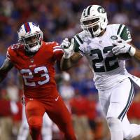 New York's Matt Forte (right) runs for a touchdown as Buffalo's Aaron Williams gives chase during the second half of the Jets' 37-31 win on Thursday. Forte's touchdown trifecta too much for Bills to overcome