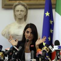 Rome Mayor Virginia Raggi speaks at a news conference after she did not show up at a scheduled meeting with a delegation of the Italian Olympic Committee in the capital city on Wednesday. Rome Mayor Virginia Raggi rejects 2024 Olympic bid