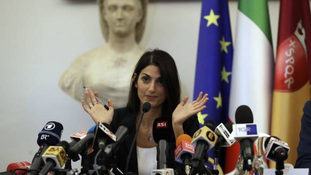 Rome Mayor Virginia Raggi speaks at a news conference after she did not show up at a scheduled meeting with a delegation of the Italian Olympic Committee in the capital city on Wednesday. Rome Mayor Virginia Raggi rejects 2024 Olympic bid