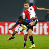 Feyenoord's Jan-Arie van der Heijden (right) challenges Manchester United's Marcus Rashford on Thursday. Feyenoord takes down Man United