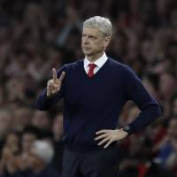 Arsene Wenger watches his Arsenal players take on Chelsea on Saturday in London. Wenger celebrates anniversary with win over Chelsea