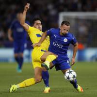 Leicester City's Danny Drinkwater (right) shields the ball from Porto's Andre Silva on Tuesday. Leicester beats Porto for second win