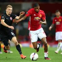 Manchester United's Marcus Rashford (right) vies for the ball with Zorya's Dmytro Grechyshkin in Europa League play at Old Trafford on Thursday night. Man United won 1-0. Rooney back in action in Man United victory