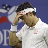 Kei Nishikori reacts during his semifinal match against Stan Wawrinka during the U.S. Open on Friday in New York. Wawrinka won 4-6, 7-5, 6-4, 6-2. Nishikori falls against Wawrinka in semifinal round at U.S. Open