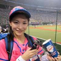 Retiring beer girl Misato Orikasa prepares to draw one of the last Asahi Super Drys of her four-year career selling brewskis at Seibu Lions games. Making a toast to retiring beer girl Misato